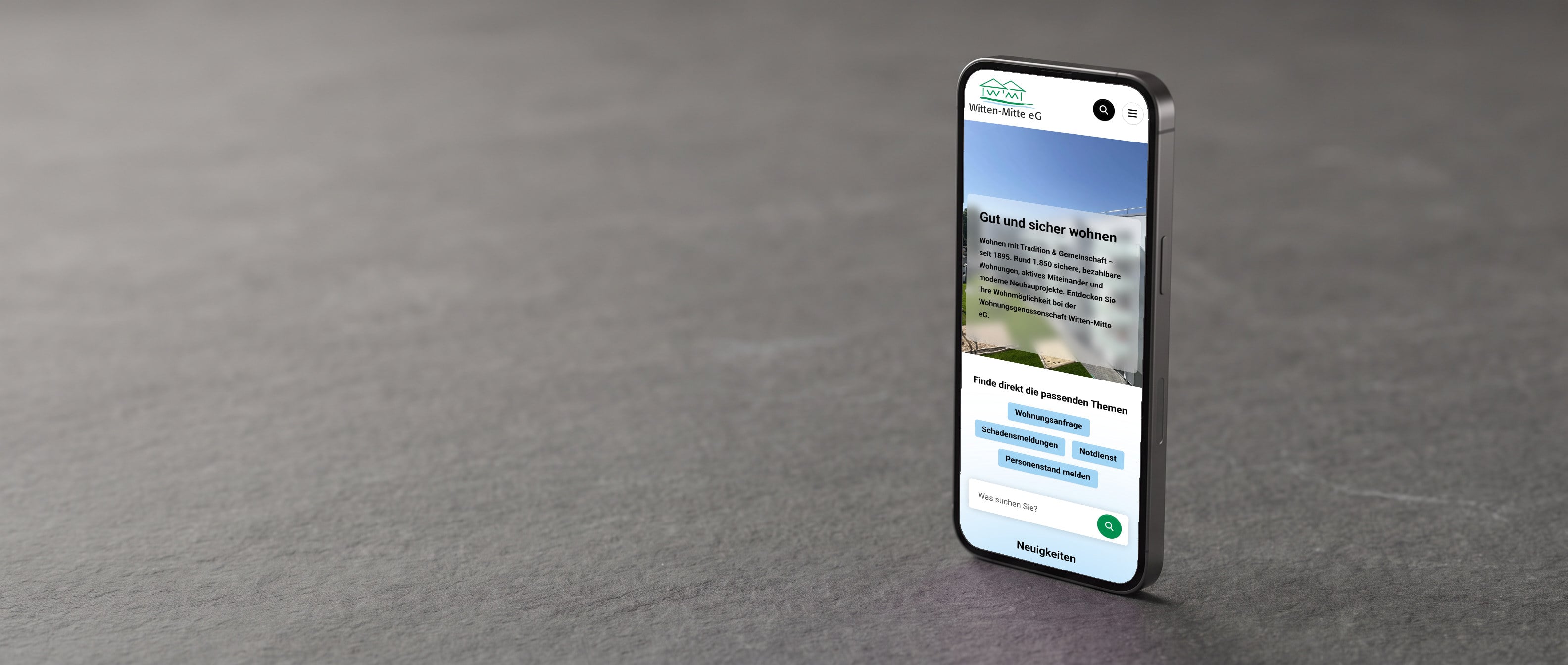 Die Website der Wohnungsgenossenschaft Witten-Mitte auf einem Telefon